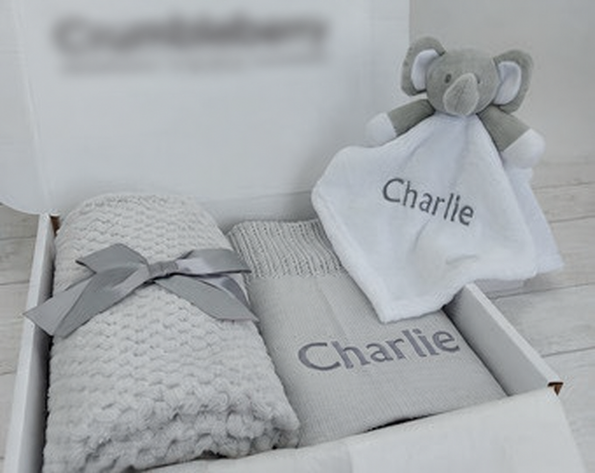 grey blankets and comforter gift set; original reference photograph with packaging logo blurred