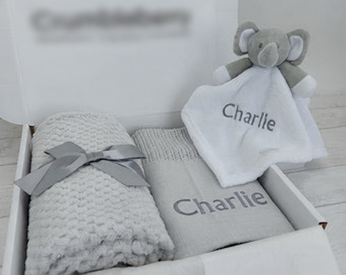 grey blankets and comforter gift set; original reference photograph with packaging logo blurred